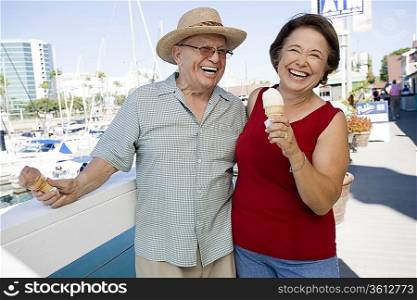 Senior couple holding ice creams