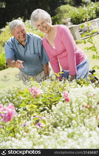 Senior couple in a flower garden