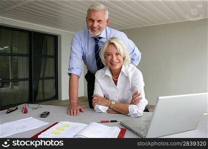 Senior couple in business