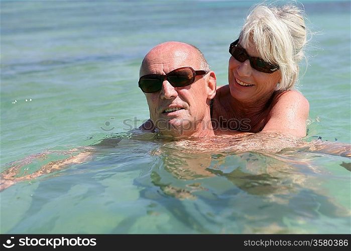 Senior couple in the sea