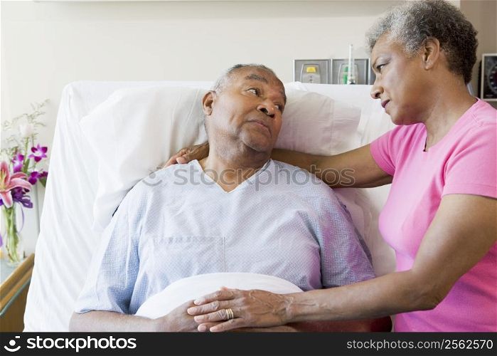 Senior Couple Looking Serious In Hospital