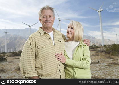 Senior couple near wind farm