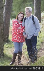 Senior Couple On Country Walk Through Woodland