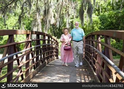 Senior couple on Florida vacation, going for picnic.