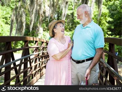 Senior couple on Florida vacation, laughing together.