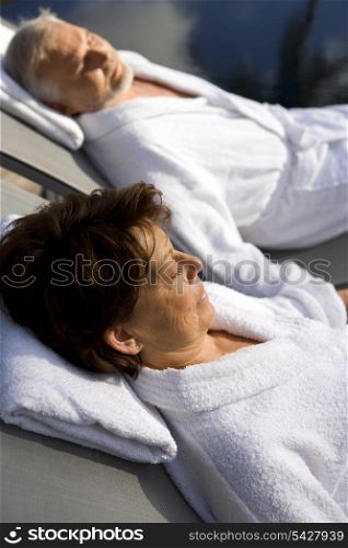 senior couple on vacation wearing bathrobes