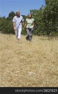 Senior couple on walk, holding hands