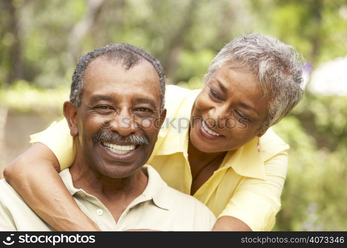 Senior Couple Outdoors Hugging