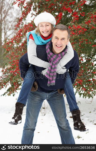 Senior Couple Outside In Snowy Landscape