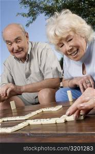 Senior couple playing dice game