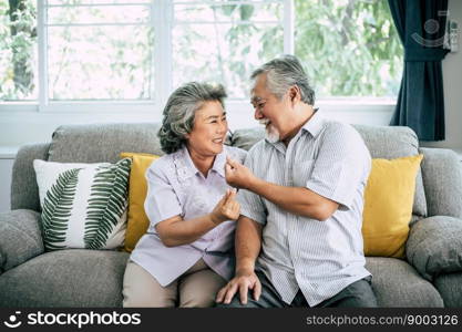 Senior couple Playing together at living room