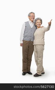 Senior couple pointing