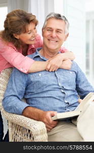 Senior couple relaxing at home