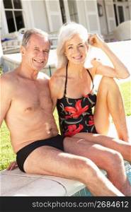 Senior Couple Relaxing by Outdoor Pool
