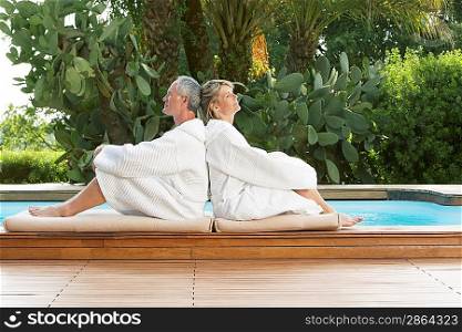 Senior Couple Relaxing by Poolside