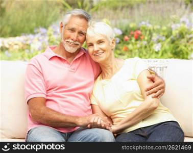 Senior Couple Relaxing In Garden