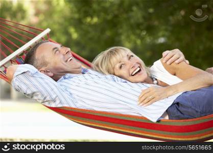 Senior Couple Relaxing In Hammock