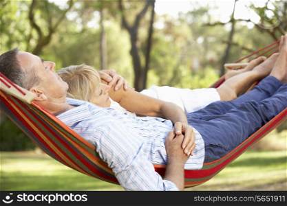 Senior Couple Relaxing In Hammock