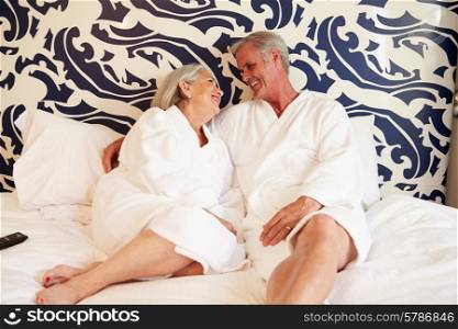 Senior Couple Relaxing In Hotel Room