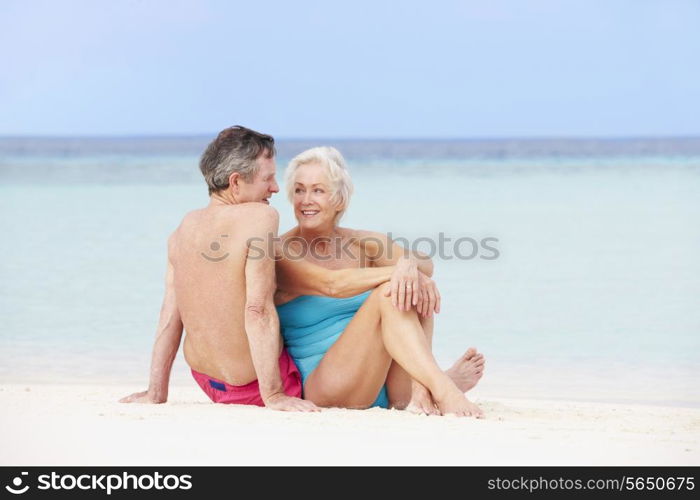 Senior Couple Relaxing On Beautiful Beach Together