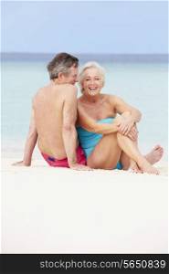 Senior Couple Relaxing On Beautiful Beach Together