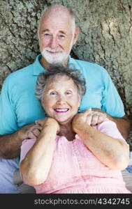 Senior couple relaxing outdoors. Focus on the wife.