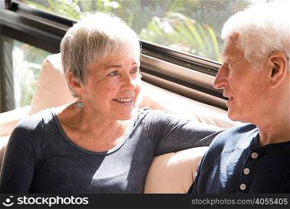 Senior couple, relaxing, sitting face to face