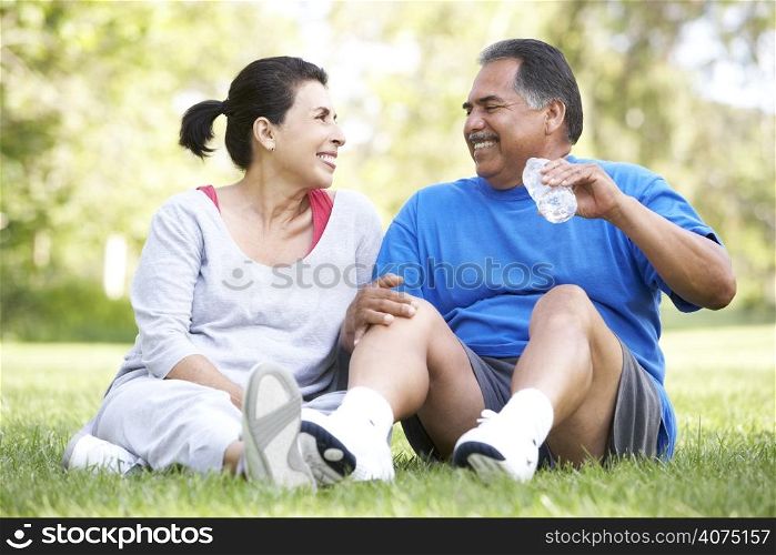 Senior Couple Resting After Exercise