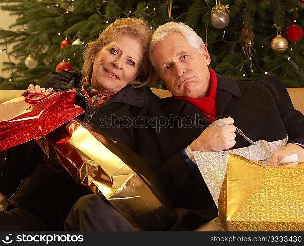 Senior Couple Returning After Christmas Shopping Trip