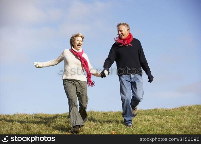 Senior Couple Running In The Park