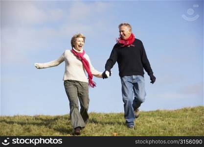 Senior Couple Running In The Park