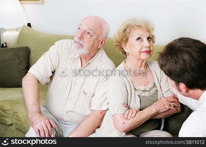 Senior couple seeing a marriage counselor, won&rsquo;t speak to one another.
