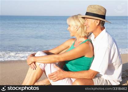 Senior couple sitting on beach relaxing