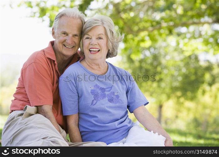 Senior couple sitting outdoors