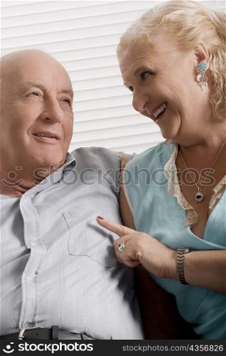 Senior couple sitting together and smiling