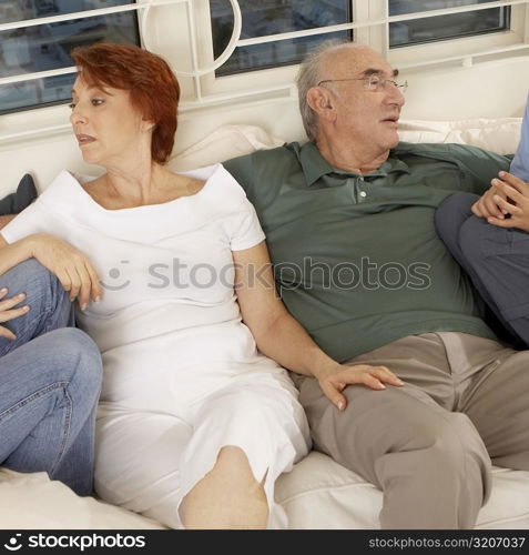 Senior couple sitting together on a couch