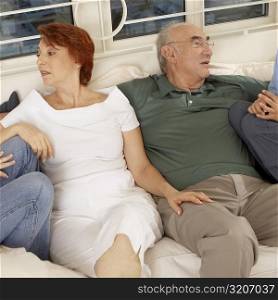 Senior couple sitting together on a couch