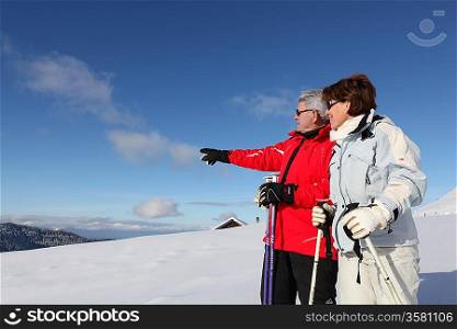 senior couple skiing