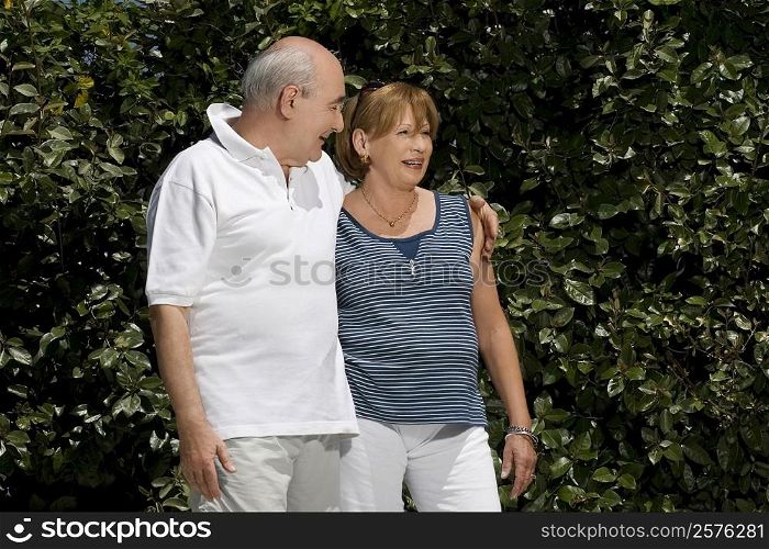 Senior couple smiling in a park