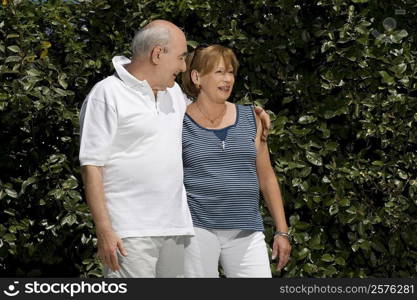 Senior couple smiling in a park
