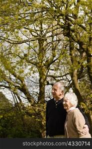 Senior couple standing in the garden