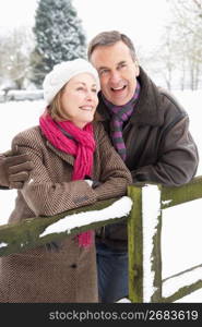 Senior Couple Standing Outside In Snowy Landscape