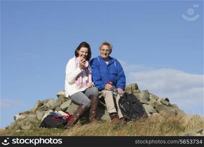 Senior Couple Stopping For Lunch On Countryside Walk