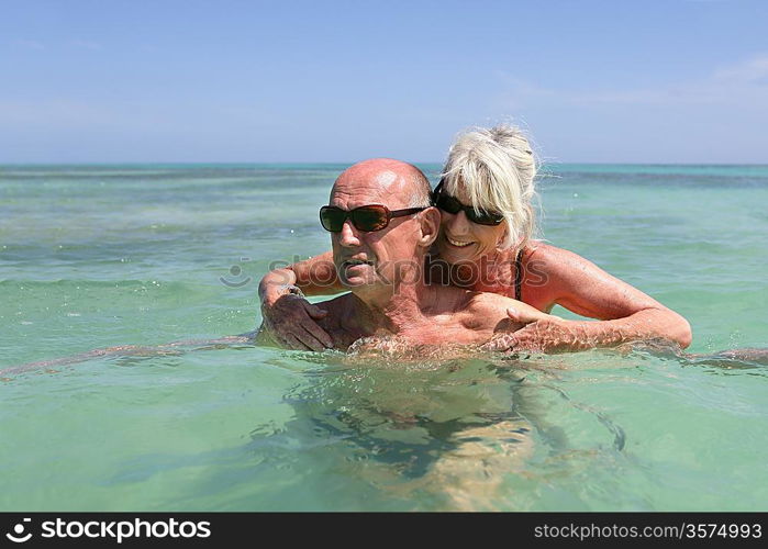 senior couple swimming