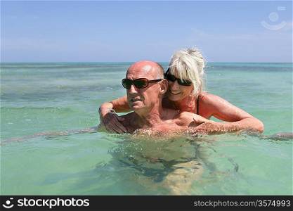 senior couple swimming