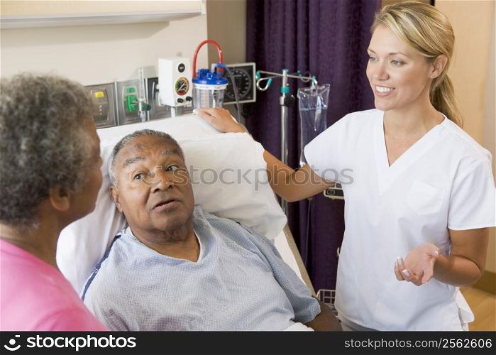 Senior Couple Talking To Doctor