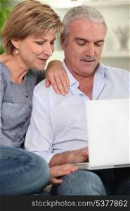 senior couple using computer