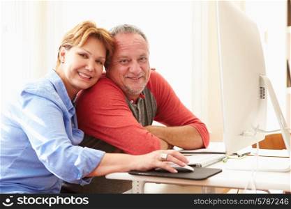 Senior Couple Using Computer At Home
