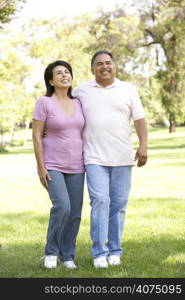 Senior Couple Walking In Park