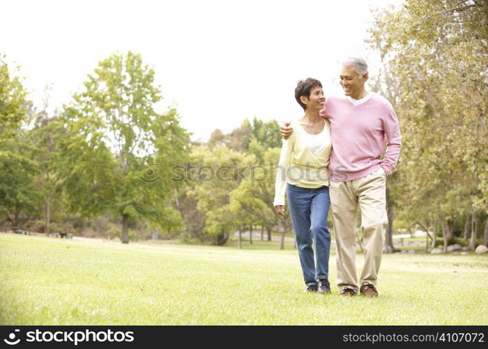 Senior Couple Walking In Park